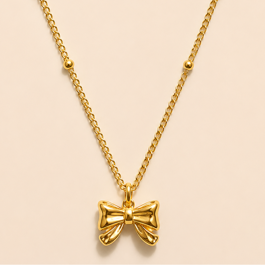Gold satellite Bow tie necklace