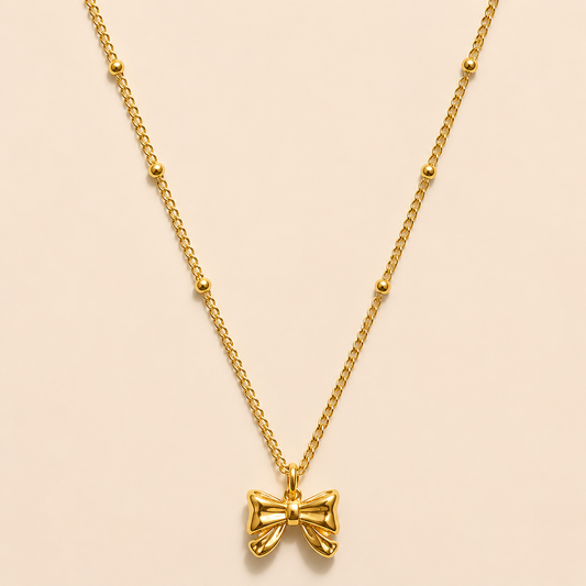 Gold satellite Bow tie necklace