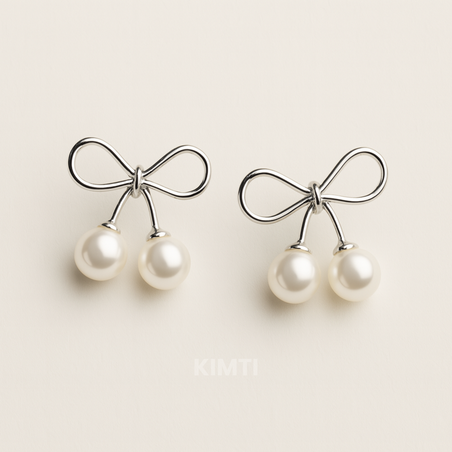 Silver Bow Pearl Drop Earrings