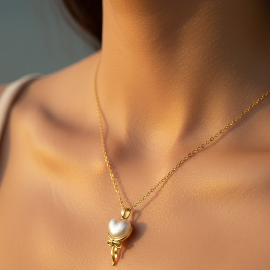 Delicate gold necklace with pearl heart