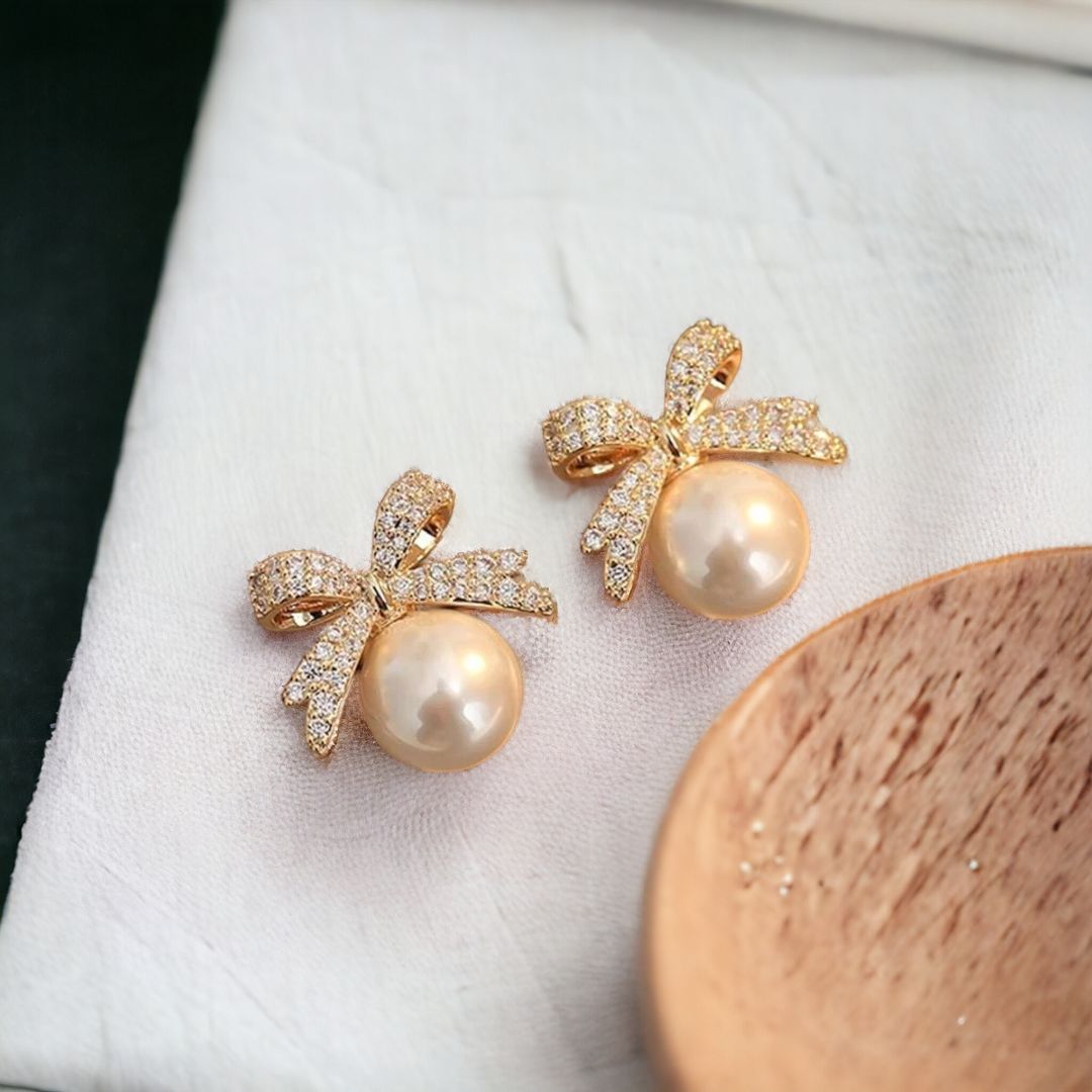 Bow Pearl Golden Stud Earrings